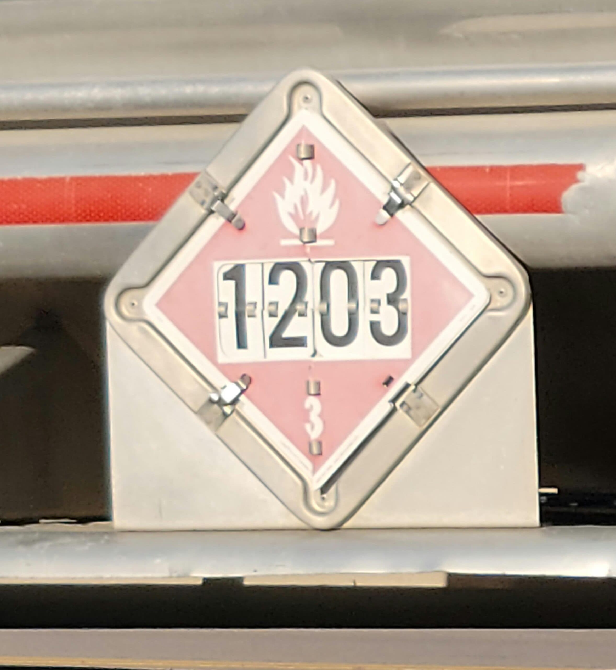 UN 1203 flammable liquid placard on a cargo tank