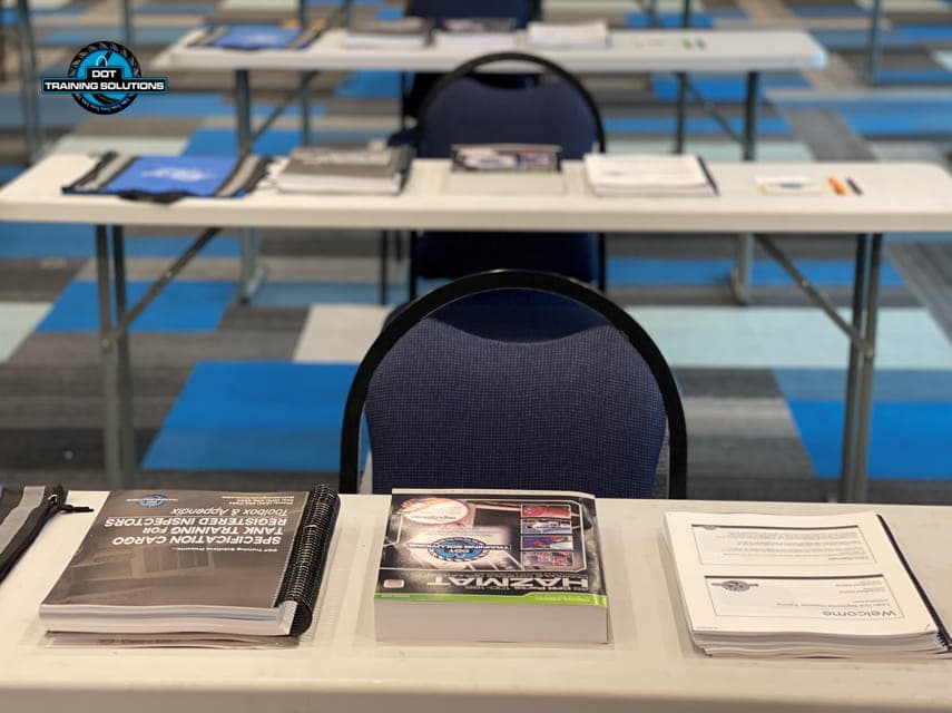 DOT Hazmat training course materials laid out on classroom tables